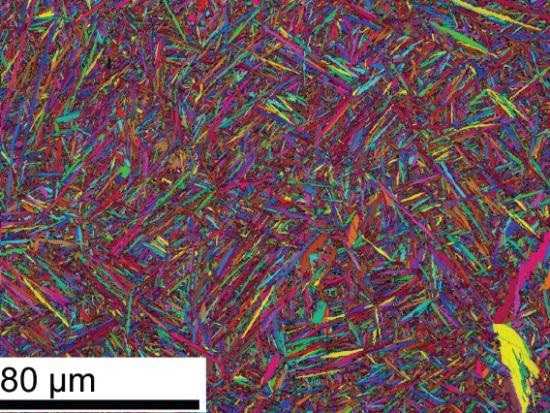 EBSD grain map from SLM deposited titanium where detected grains are randomly colored to showcase size and morphology.