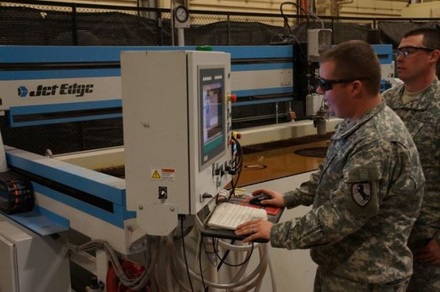 SPC Roberts and PFC Adams are programming and building a part with the SigmaNEST® software.
