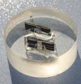 Solar cell interconnects mounted in EpoxiCure® epoxy