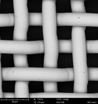 SEM images of two metal grids, using 15 kV (top) and 10 kV (bottom) beam