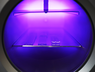 PDMS microfluidic channels undergoing plasma treatment.