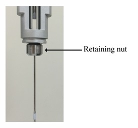 Illustration of the retaining nut in the PEAQ-ITC pipette unit. The retaining nut is indicated with an arrow and label.