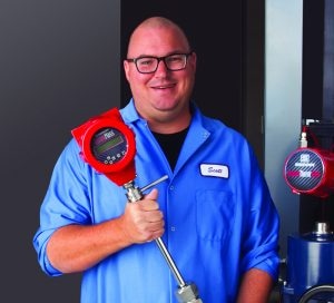 One of our flow energy management experts, Scott, with a vortex flow meter that takes the guess work out of knowing your steam pressure.
