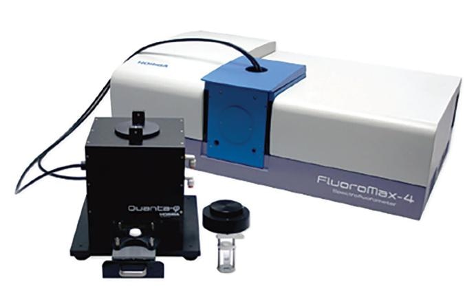 An integrating sphere fiber-coupled to a fluorometer for PLQY measurements.