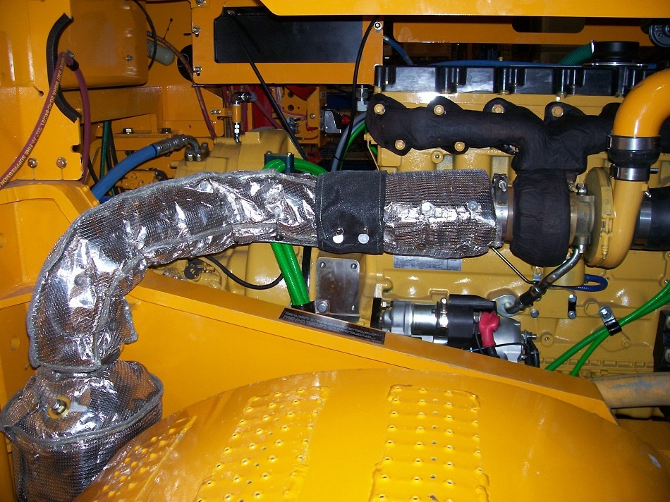 Firwin MineWrap™ removable blankets and Hard Coat™ permanent insulation on mining truck exhaust.