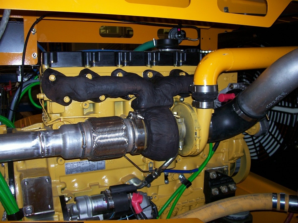 Hard Coat ™ permanent insulation on mining truck manifold and turbo.