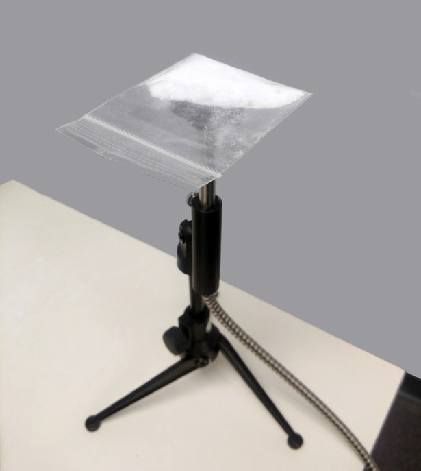 Diffuse reflectance probe (in stand) with sample in polyethylene bag