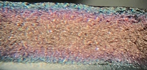 Cross section of a frit that was coated with SilcoNert 2000. While there is a gradient of thickness from the center of the frit to the edges, the difference in coating thickness is only about 30 nm from the center to the edge.