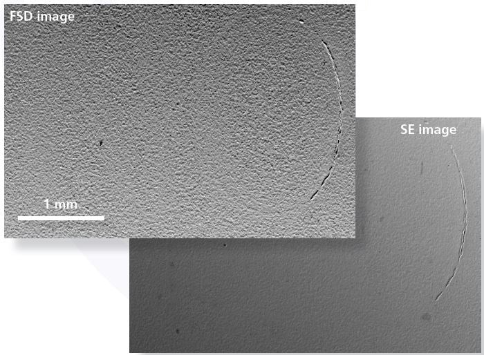 Forescatter Diode (FSD, upper) and Secondary Electron (SE, lower) images show that only a partially visible letter “O” in the serial number is seen using traditional SEM techniques.