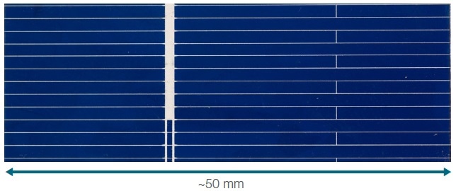 Silicon solar cell. The thin traces are composed of Ag paste.