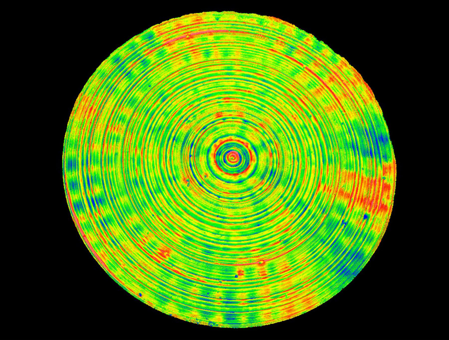 A typical COMPASS texture map of a full mobile phone camera lens mold pin. One can clearly see the circular tooling marks from the diamond turning as well as the radial waviness arising from small vibrations on the cutting tool when the pin was manufactured.