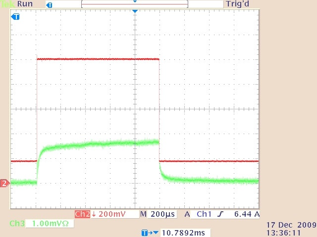 The quasi-cw laser output (lower trace) and drive current waveform (upper trace) for 0.5-ms duration. 8.2 A drive current pulse superimposed on a 1.8 A continuous bias current.