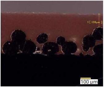 Bearing construction showing machineable polymer overlay, in this case 126 µm.