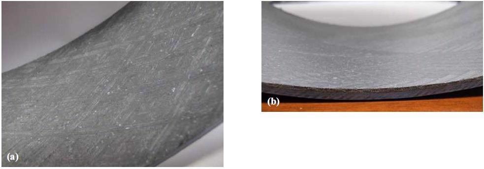 Macro images of the machined surface of the discontinuous PTFE fiber bearing liner, produced with a 3 mm radius tool. Images (a) and (b) were processed similarly, photographed at different angles.