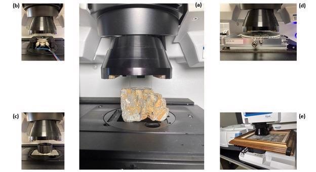 Figure 1:  	(a) Large mineral sample on the Nicolet RaptIR FTIR Microscope stage with the 15X infrared objective in position, (b) electrochemical cell, (c) inert atmosphere cell, (d) heating / cooling stage, (e) painting