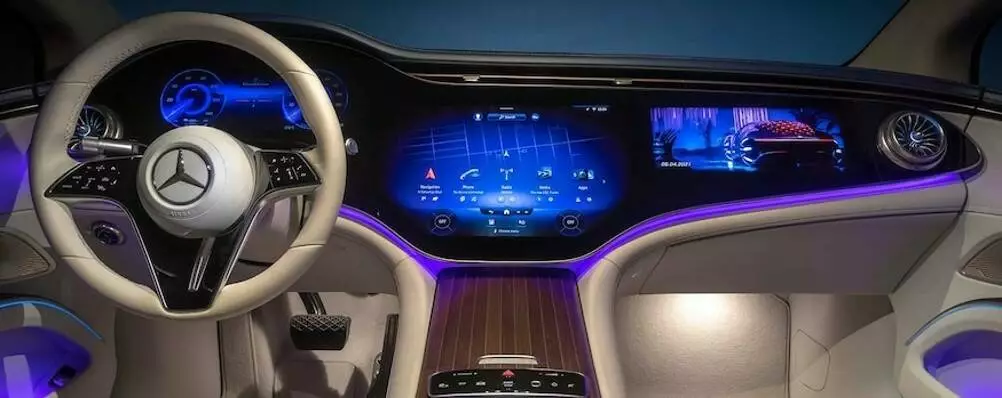 Mercedes-Benz 2022 EQS 56” “Hyperscreen” includes an LCD instrument cluster display and two flexible OLED screens for  center-stack and passenger displays, with all panels bonded under a single sheet of cover glass.