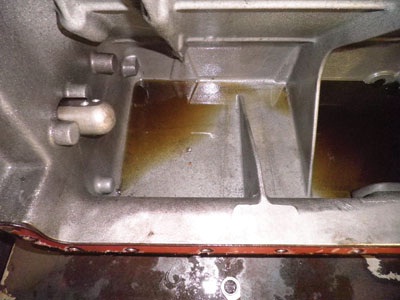 Visible chunks of metal in the sump of the disassembled engine