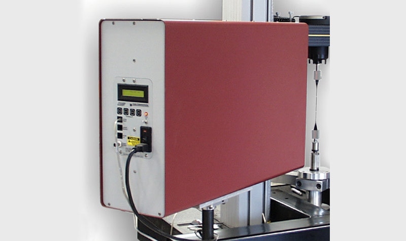 Non-Contacting Laser Extensometers for Strain Measurement in Materials Testing