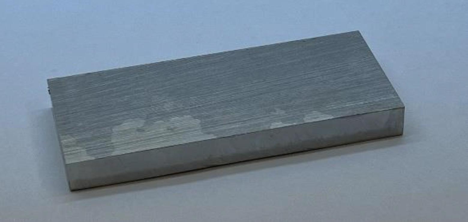 Photograph of the cladding itself (cut from the top of another cladded block).