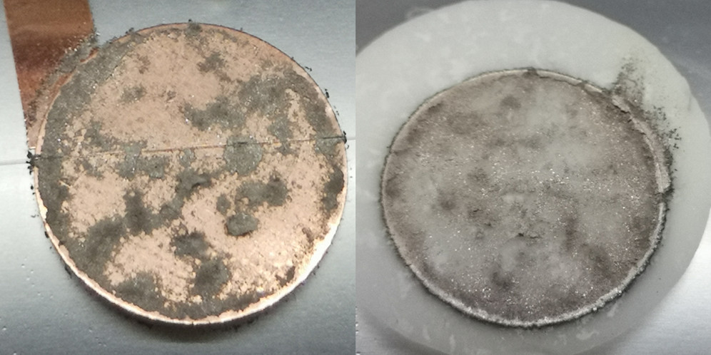 Copper working electrode after the plating experiment showing the fiber optic sensor, mossy metallic sodium, and traces of attached glass-fiber separator (left). Glass-fiber separator with the surface that was facing the copper working electrode showing that metallic sodium infiltrated the separator (right).
