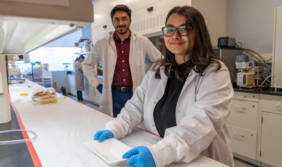 Graduate students Shadman Khan, left, and Akansha Prasad are co-lead authors on a paper about a packaging tray that can signal when food is contaminate with salmonella or other dangerous pathogens.