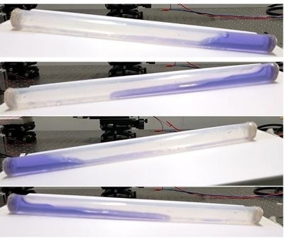 Researchers harvest more energy from waves by moving a liquid–solid nanogenerator’s electrode to the end of the tube where the water crashes. Image Credit: Adapted from ACS Energy Letters 2024????