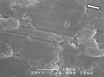 AZoJoMo - AZoM Journal of Materials Online - SEM micrographs of the worn surface of monolithic alumina 1800oC (ó : the sliding direction).